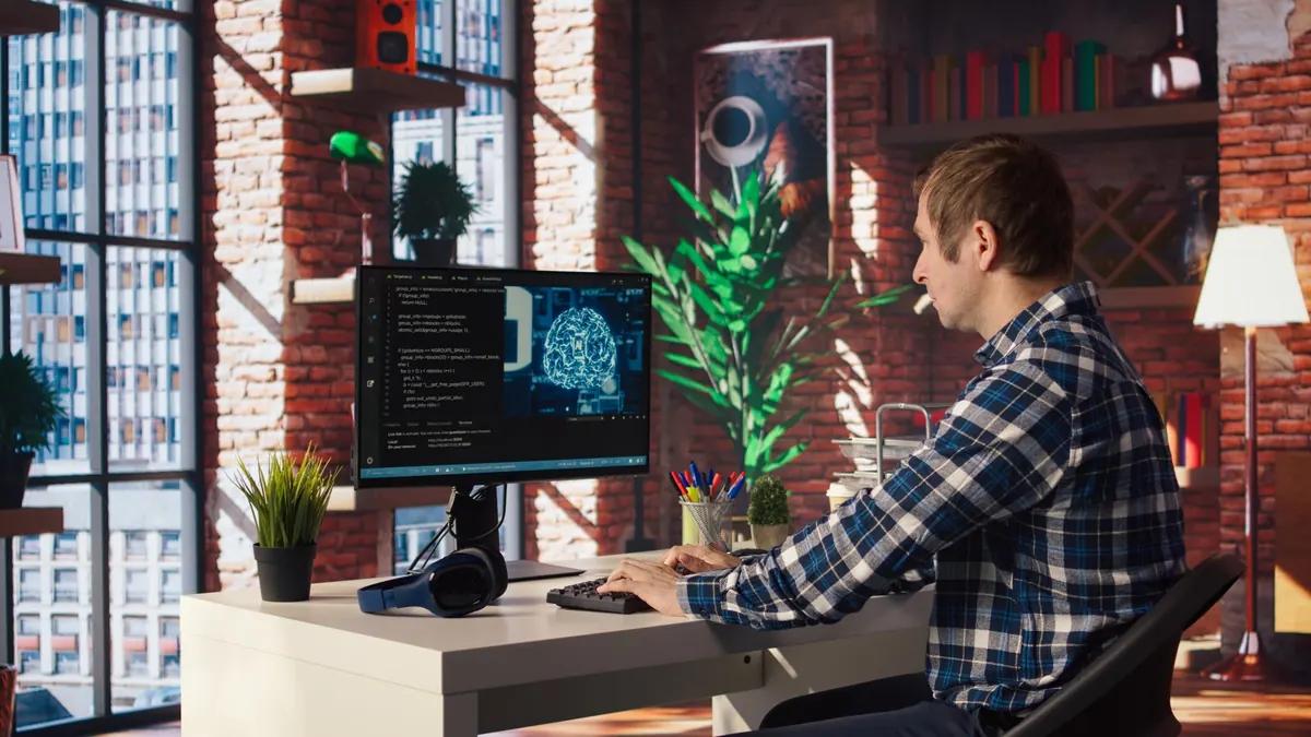 Developer reviewing AI generated code on multiple monitors